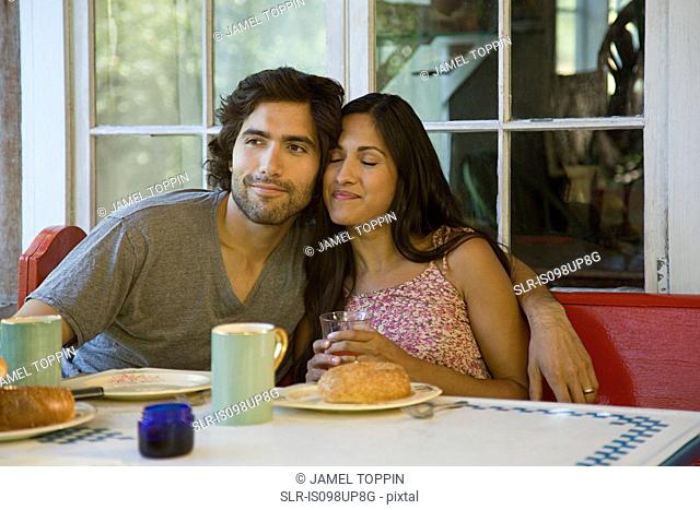 Couple relaxing at breakfast