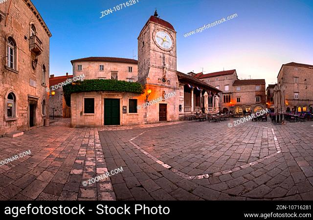 TROGIR, CROATIA - SEPTEMBER 28, 2015: Saint Sebastian Church and Trg Ivana Pavla II in Trogir, Croatia. Trogir was founded in the 3rd century BC