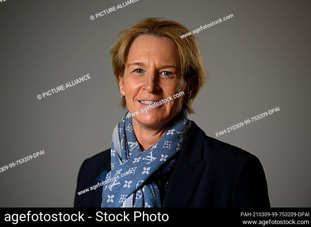 08 March 2021, Saxony, Dresden: Martina Voss-Tecklenburg, national coach of the German women's national football team, is about to begin a panel discussion on...