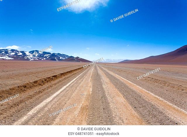 Bolivian dirt road perspective view, Bolivia. Salvador Dali Desert