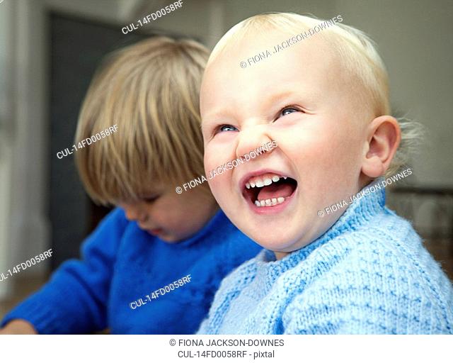 A boy toddler laughing