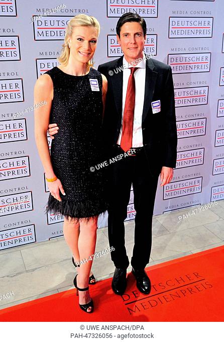 Olympic skiing gold medalist Maria Hoefl-Riesch and her husband Marcus Hoefl arrive to the ceremony for the German Media Prize for 2013 at the Congress Center...