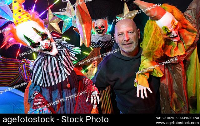 PRODUCTION - 26 October 2023, Schleswig-Holstein, Lübeck: Patric Nonnweiler stands in a party tent on the driveway of his house in the Kücknitz district among...