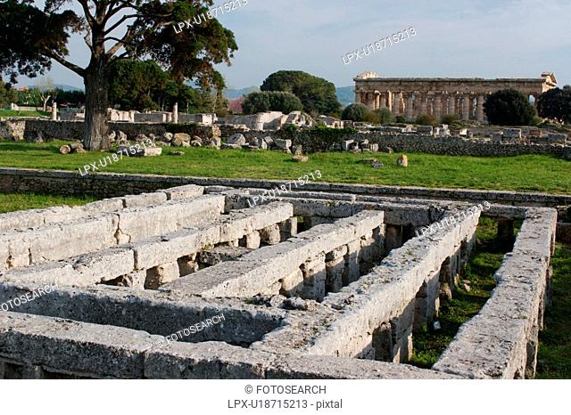 Greek Temples in Campania, Italy: Ruin of Roman swimming pool with labyrinth, with Temple of Neptune Poseidon aka Temple of Hera II