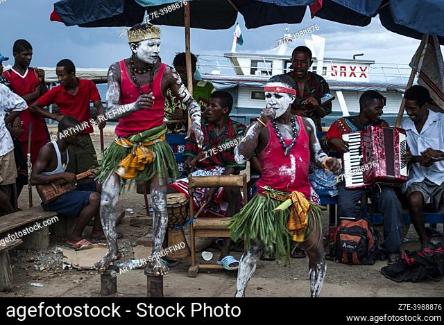 Musical group performs for visitors at pier. Nosy Be, Madagascar