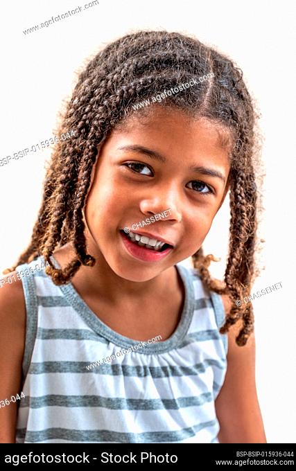Little girl doing facial expressions face on white
