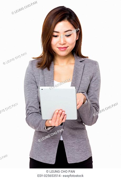 Asian young businesswoman use of the tablet pc