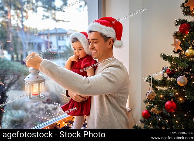 father and baby daughter on christmas at home
