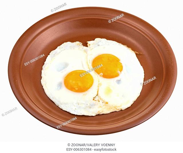 fried eggs on ceramic brown plate