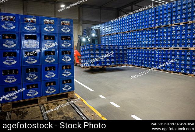 01 December 2023, Bavaria, Oettingen: Beverage crates are stored at the Oettinger brewery. Due to the difficult situation on the German beer market