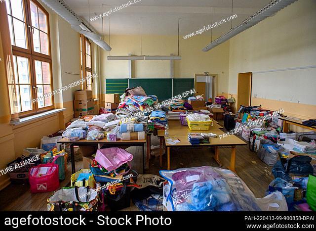PRODUCTION - 07 April 2022, Saxony-Anhalt, Dessau-Roßlau: Donated household goods are stored in a classroom of a former school