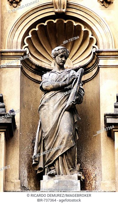Statue of a woman on a building facade in the historic centre of Prague, Czech Republic, Europe