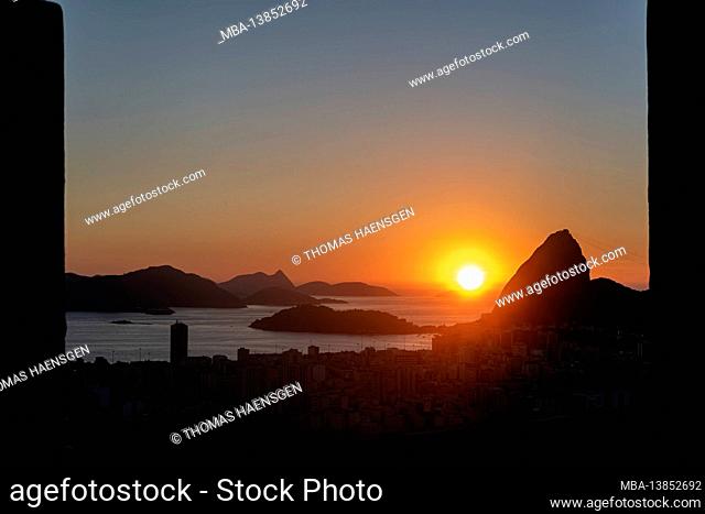 Early morning shot of the sunrise behind Sugarloaf Mountain and Botafogo in Rio de Janeiro, Brazil