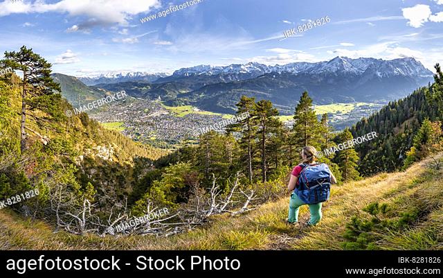 Young hiker on the trail to the Kramer, Wetterstein Mountains at the back, Garmisch, Bavaria, Germany, Europe