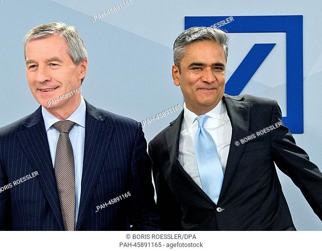 Co-CEOs of Deutsche Bank Anshu Jain (R) and Juergen Fitschen arrive for the press conference to discuss the business figures for 2013 in Frankfurt Main