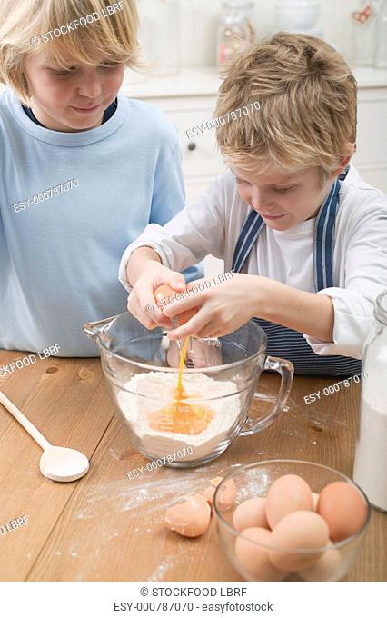 Two boys baking