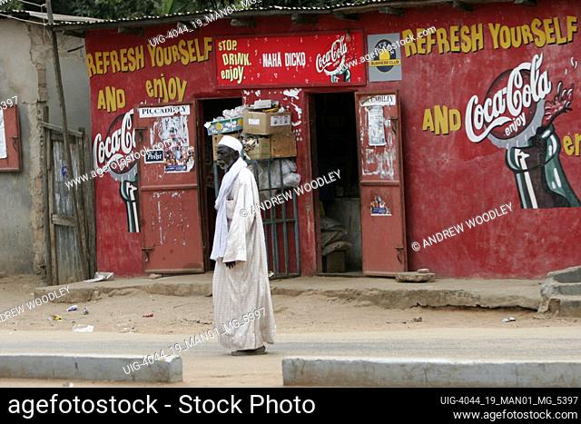 Gambian man in robe outside store Bakau The Gambia