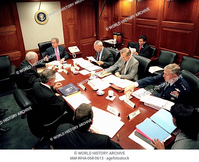 President George W Bush, meets with top security and government officials, in the White House situation Room, during the aftermath days following the September...
