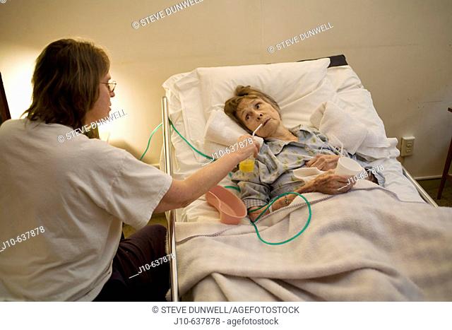 Age 89 woman dying at home, with daughter. Hospice care. Poughkeepsie, NY. USA