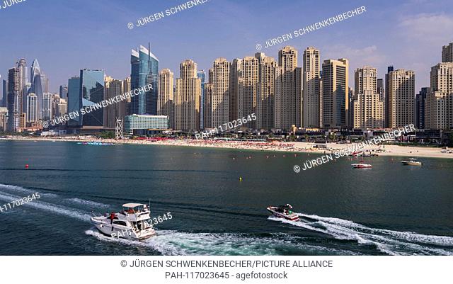 The Beach"" is the name of the popular beach section in Dubai, behind which the imposing skyscrapers of the exclusive Marina Bay district rise