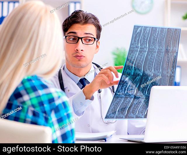 The doctor examining x-ray images of patient