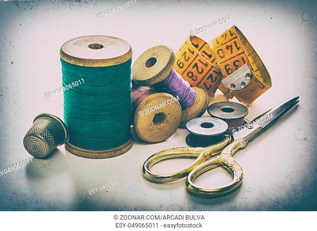 Creative image of sewing accessories for needlework and sewing, hobby, on white background, retro style