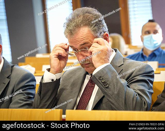 03 September 2021, Hessen, Frankfurt/Main: The chairman of the train drivers' union GDL, Claus Weselsky (M), sits in the hearing room at the beginning of the...
