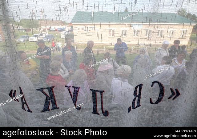 RUSSIA, KRASNOYARSK REGION - JUNE 19, 2023: Patients are seen outside a railway car of the Doctor Voino-Yasenetsky-St Luke mobile diagnostic center in the town...