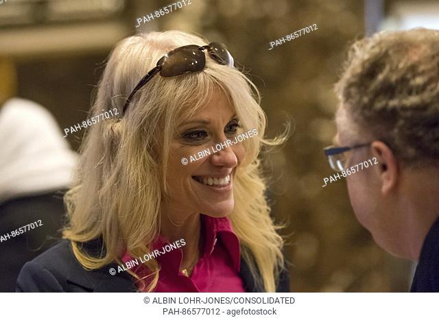 Trump campaign manager Kellyanne Conway is seen in the lobby of Trump Tower, posing for selfies with visitors while responding to questions posed by members of...