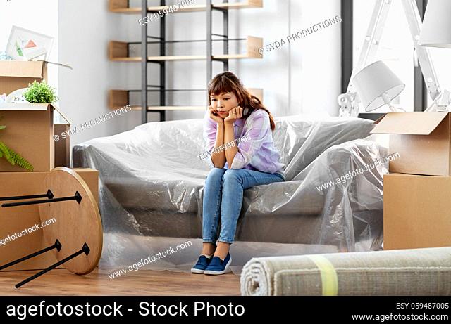 sad asian woman with stuff moving to new home
