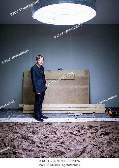 The artist Gregor Schneider stands in the Federal Art Hall in the room ""Matschraum"" (lit. ""mud room"") in Bonn, Germany, 30 November 2016