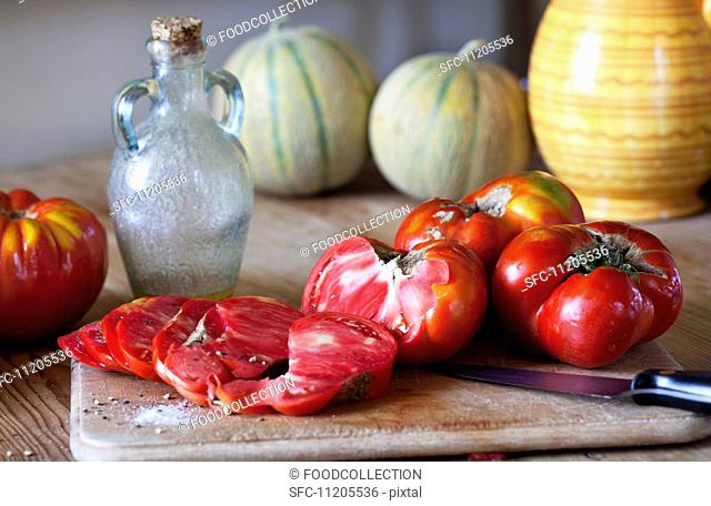 Oxheart tomatoes, one partly sliced