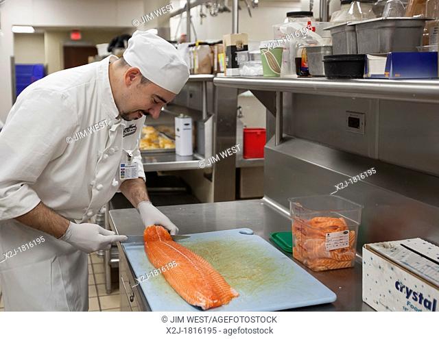 West Bloomfield, Michigan - Chef Jay Lovell prepares salmon for patient meals in the kitchen of Henry Ford West Bloomfield Hospital