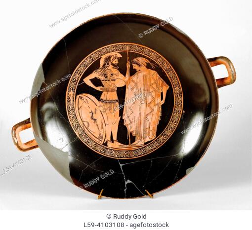 Farewell of a warrior. The interior of the drinking bowl shows a farewell scene: a woman gives a farewell donation from a jug to a bearded warrior in armor who...