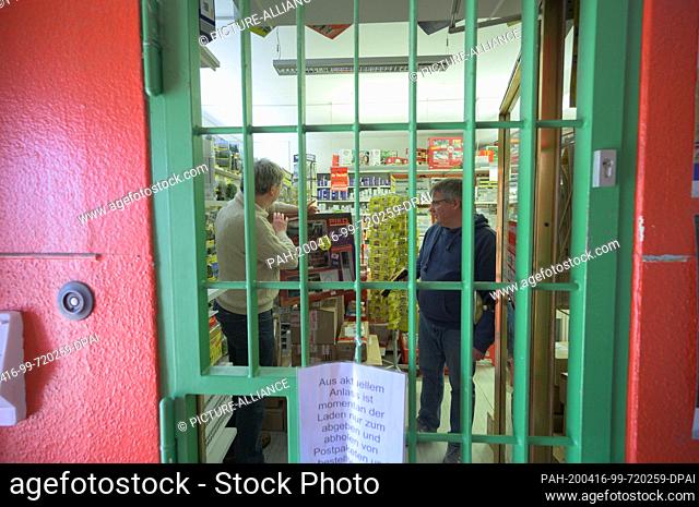 16 April 2020, Rhineland-Palatinate, Mainz: Volker Schäfer (l) and Oliver Euen, employees and specialist salespeople, are standing in their shop and preparing...