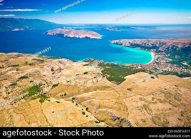 Moon Plateau stone desert heights and town of Baska on Krk island aerial view, Adriatic archipelago of Croatia