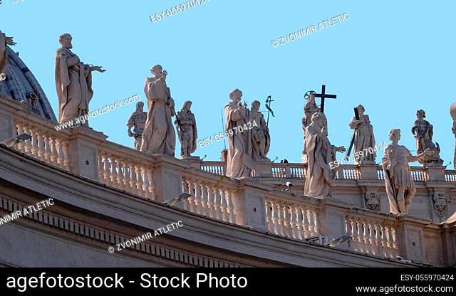 Gallery of saints, fragment of colonnade of St. Peters Basilica. Papal Basilica of St. Peter in Vatican - the world largest church