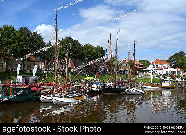 13 August 2023, Lower Saxony, Carolinensiel: Several traditional sailing ships are in the harbor on the occasion of the 32nd WattenSail