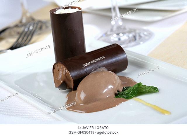 Chocolate rolls stuffed with creamed cheese and chocolate ice cream on the side
