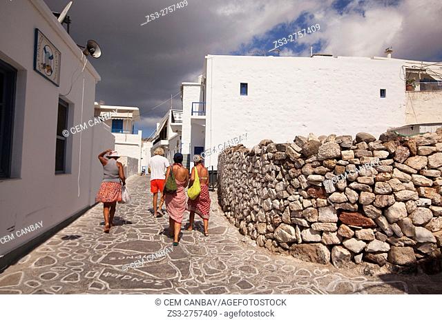 Tourists walking in the streets of the old town Chora or Chorio, Kimolos, Cyclades Islands, Greek Islands, Greece, Europe