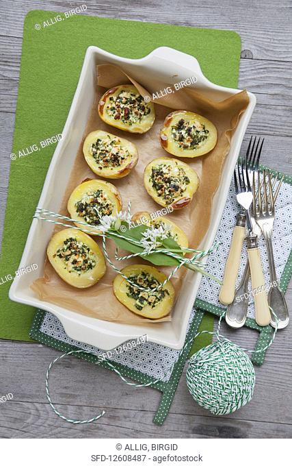 Baked potatoes with wild garlic and sheep's cheese