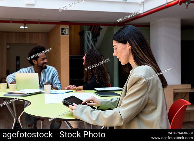 Businesswoman using a tablet PC in office