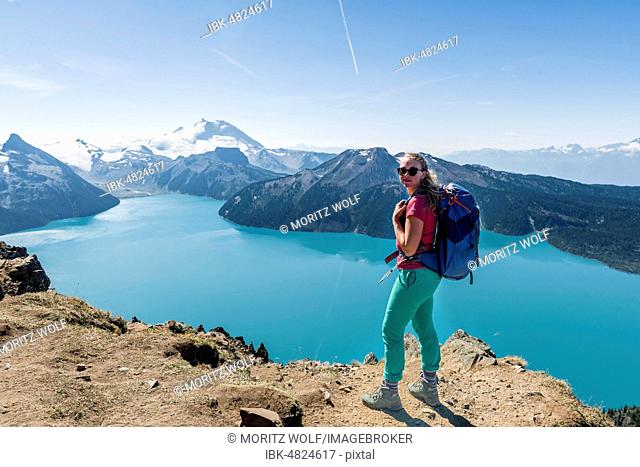 View from Panorama Ridge Hiking Trail, Hiker, Garibaldi Lake, Guard Mountain and Deception Peak, Glacier, Garibaldi Provincial Park, British Columbia, Canada