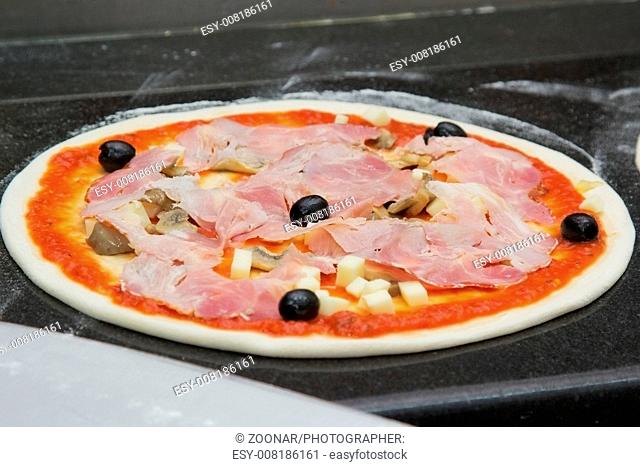 oven ready pizza with bacon and olive