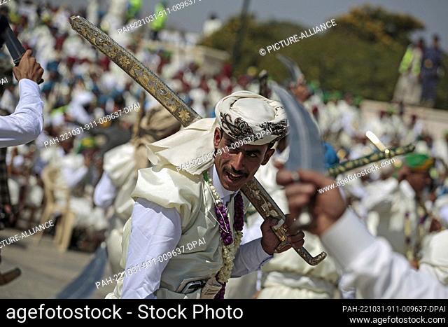 31 October 2022, Yemen, Sanaa: Grooms in traditional Yemeni attires take part in a mass wedding ceremony organized by the Houthi movement for thousands of...