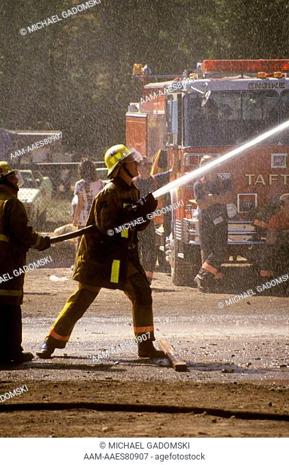 Fireman Holding Hose