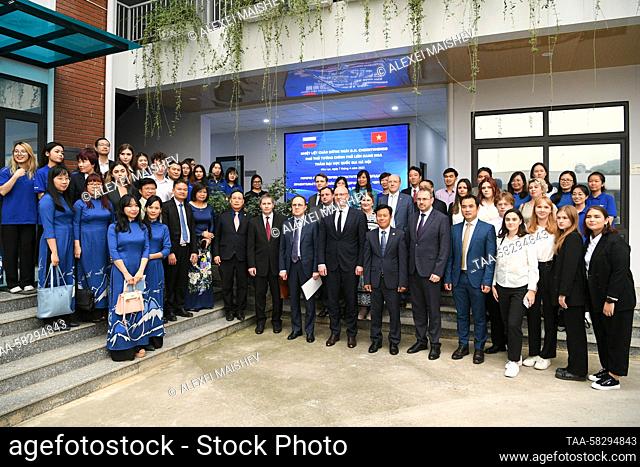 VIETNAM, HANOI - APRIL 7, 2023: Russian Deputy Prime Minister Dmitry Chernyshenko (C) poses for a group photo during a visit to the Vietnam National University...