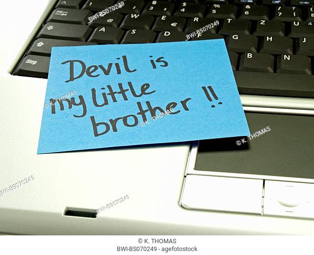 memo note on notebook, devil is my little brother