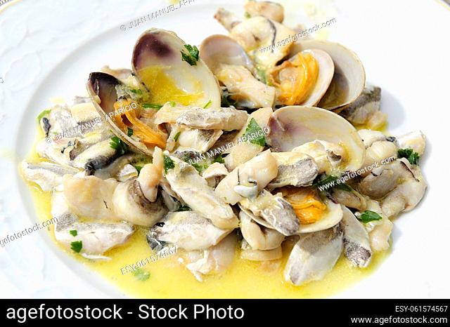Cocochas hake with clams in green sauce, a typical dish of the Basque Country