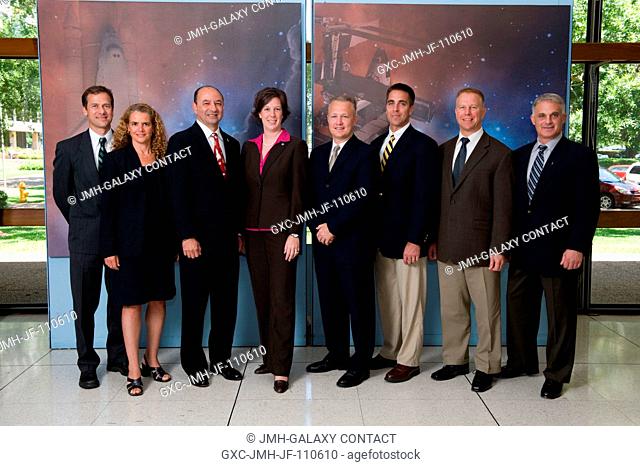 STS-127 crew members along with flight director Holly Ridings (fourth from the left) pose for a portrait following a preflight press conference at NASA's...